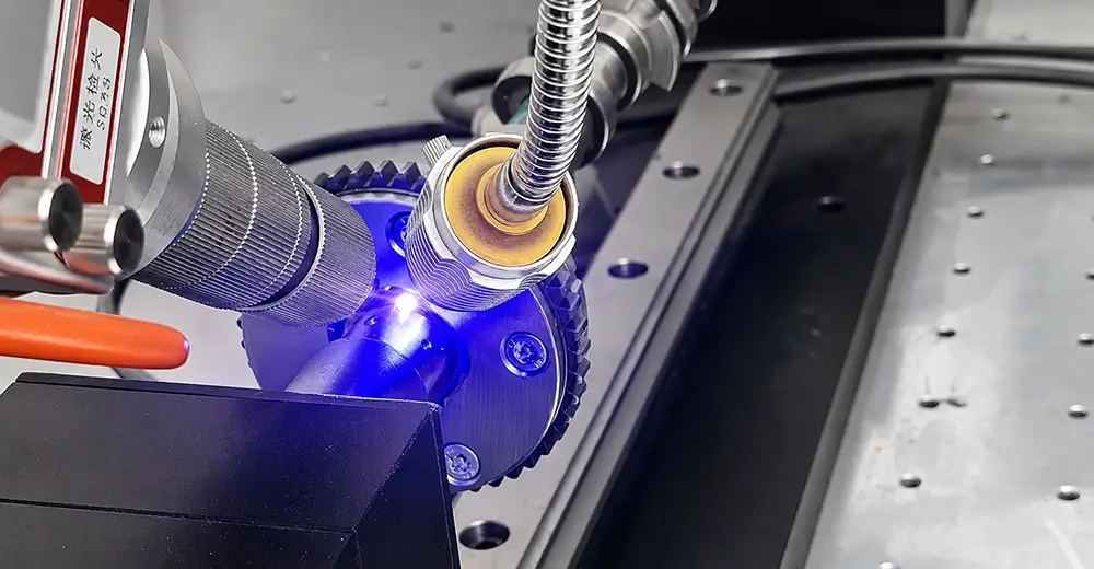 Camshaft lobe undergoing controlled surface processing during manufacturing
