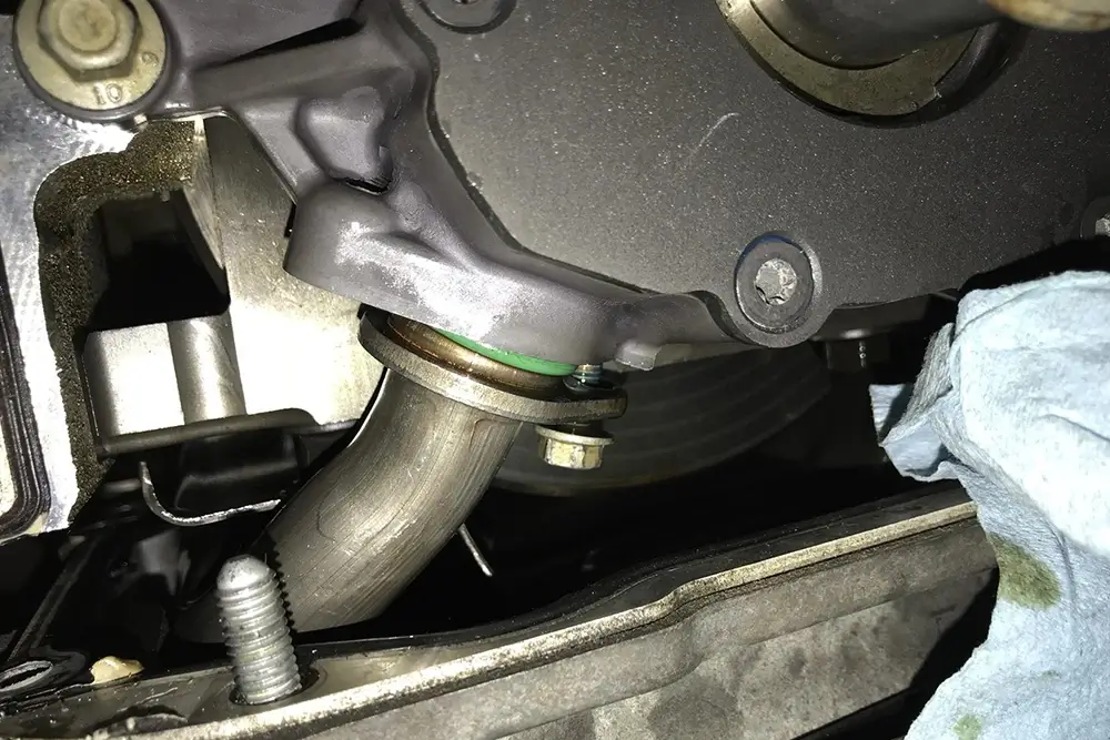 Oil pickup tube connection showing the O-ring seal at the oil pump inlet